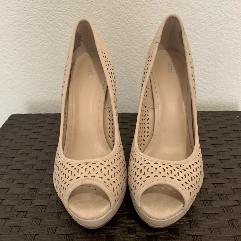 Tan suede peep toe pumps.